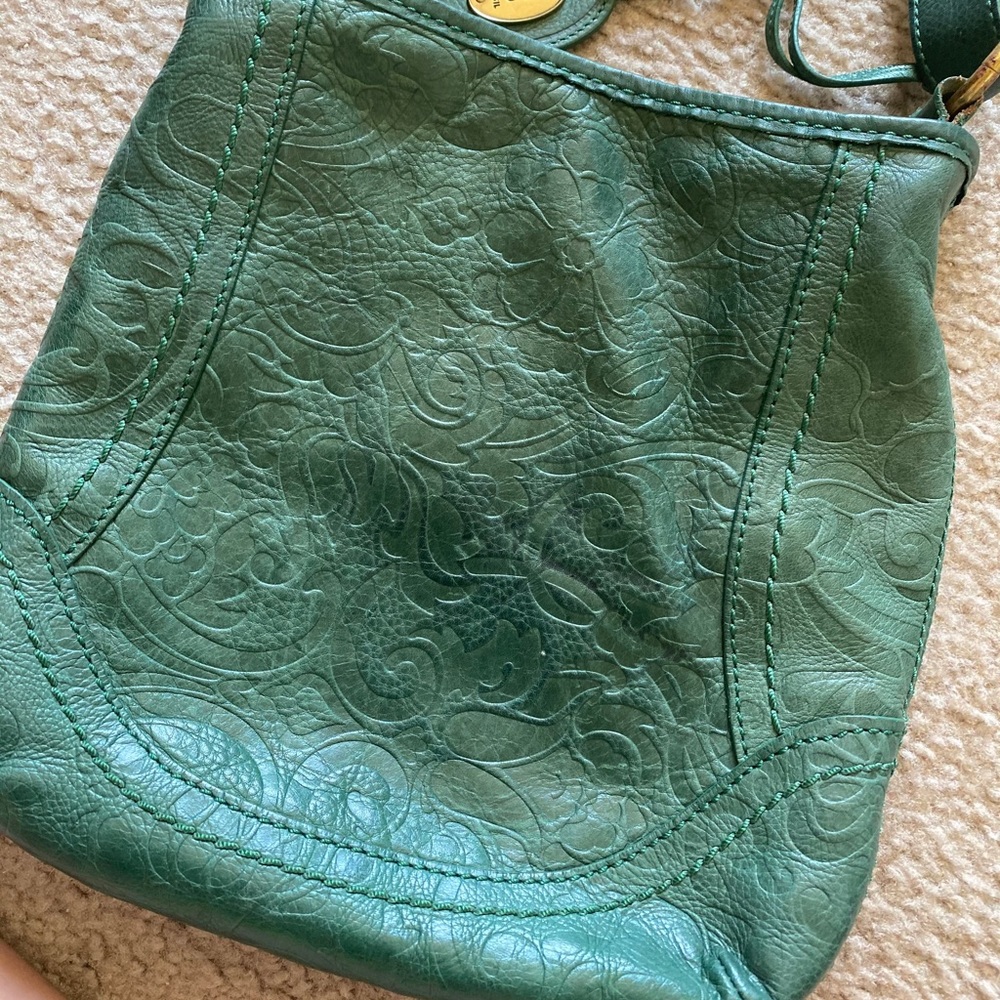 Teal/green Fossil crossbody bag.